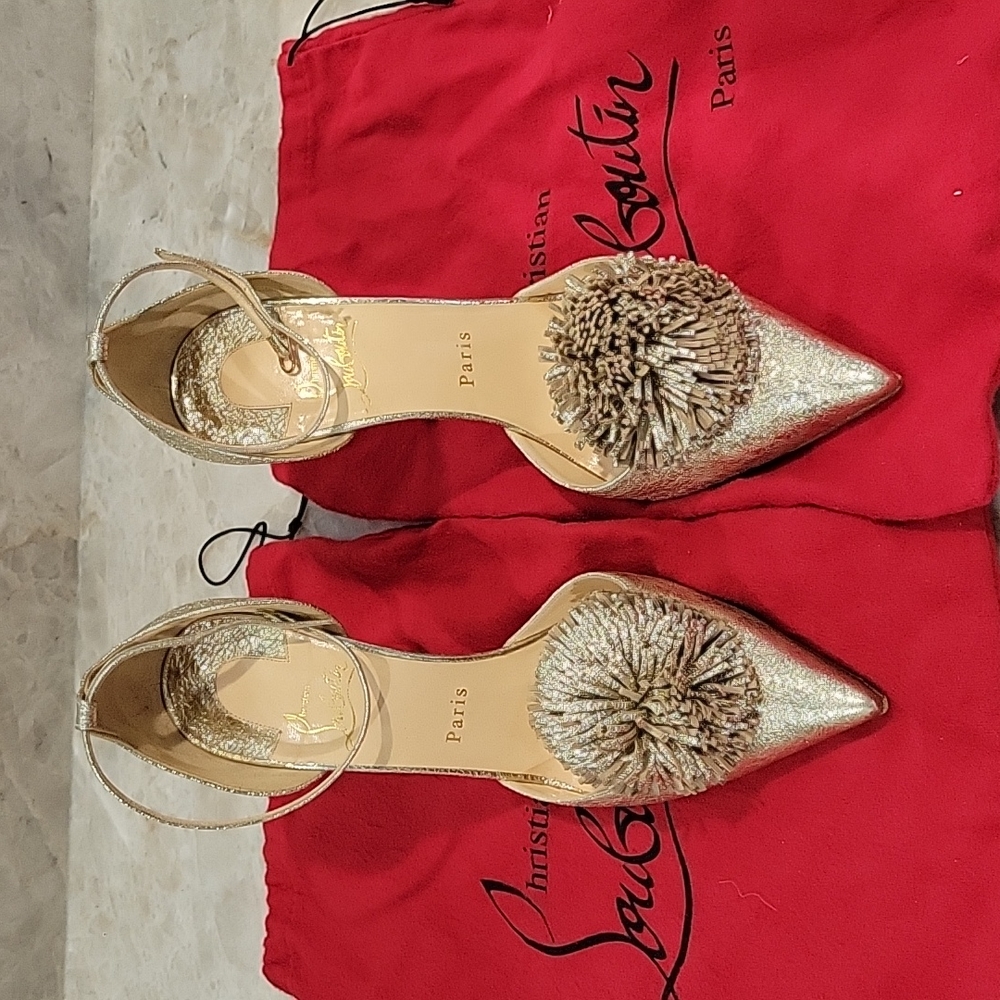 Gold Louboutin heels